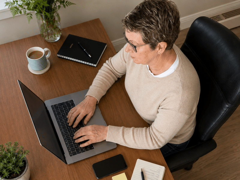 web developer working on website design for smartphone and laptop in Suffolk
